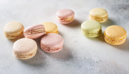 Delicious pastel macarons on table. French dessert. Sweet and tasty food. Top view.