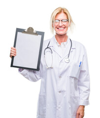 Middle age blonde doctor woman holding clipboard over isolated background with a happy face standing and smiling with a confident smile showing teeth