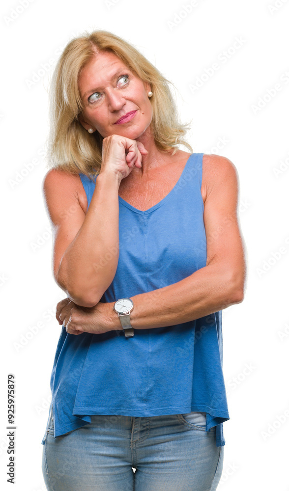 Poster Middle age blonde woman over isolated background with hand on chin thinking about question, pensive expression. Smiling with thoughtful face. Doubt concept.