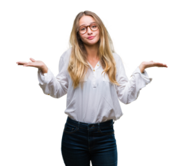 Young beautiful blonde business woman wearing glasses over isolated background clueless and confused expression with arms and hands raised. Doubt concept.
