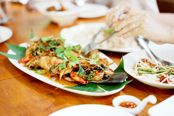 Deep-fried Sea bass with Fish Sauce. Thai Street Food.