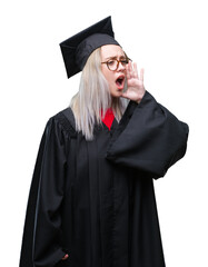 Young blonde woman wearing graduate uniform over isolated background shouting and screaming loud to side with hand on mouth. Communication concept.