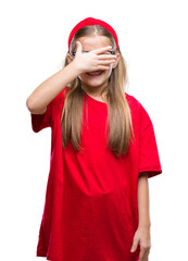 Young beautiful girl wearing glasses over isolated background smiling and laughing with hand on face covering eyes for surprise. Blind concept.