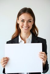 Naklejka premium Professional Woman Holding Blank Sign in Business Attire for Customizable Corporate Message or Branding