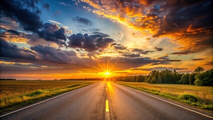 Naklejka premium Sunset casting a warm glow over an empty road , sunset, road, evening, dusk, golden hour, sun, sky, nature, atmospheric