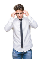 Young business man wearing glasses over isolated background with hand on head for pain in head because stress. Suffering migraine.