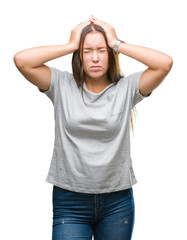 Young caucasian beautiful woman over isolated background suffering from headache desperate and stressed because pain and migraine. Hands on head.