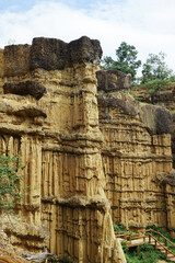 Natural rock formation with a unique and intricate pattern of vertical ridges and grooves, rough texture. Pha Chor, Grand Canyon of Chiang Mai, Thailand. Natural phenomenon