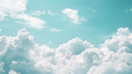 Celestial Dreamscape: A breathtaking view of fluffy white clouds drifting across a serene, teal sky. Perfect for evoking feelings of peace, tranquility, and limitless possibilities.