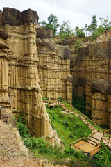 Natural rock formation with a unique and intricate pattern of vertical ridges and grooves, rough texture. Pha Chor, Grand Canyon of Chiang Mai, Thailand. Natural phenomenon