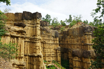 Natural rock formation with a unique and intricate pattern of vertical ridges and grooves, rough texture. Pha Chor, Grand Canyon of Chiang Mai, Thailand. Natural phenomenon