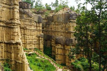 Natural rock formation with a unique and intricate pattern of vertical ridges and grooves, rough texture. Pha Chor, Grand Canyon of Chiang Mai, Thailand. Natural phenomenon