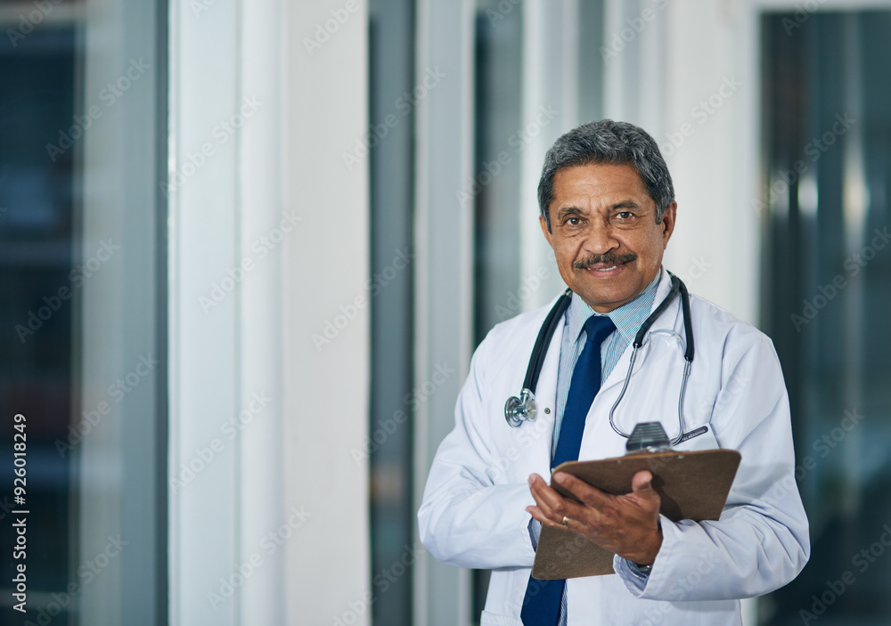 Wall mural Mature doctor, clipboard and portrait in hospital for healthcare, experience and welcome in lobby. Man, specialist and smile in waiting room with documents, advice and ready for medical consultation