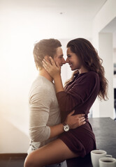 Love, flirt and couple hug in kitchen for bonding, loving relationship and relax together in home. Dating, marriage and man and woman embrace for affection, commitment and romance for trust in house