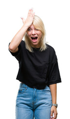 Young beautiful blonde woman over isolated background surprised with hand on head for mistake,...