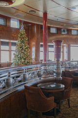 Wood paneled Art Deco interior design architecture inside lounge bar public space onboard ocean liner cruiseship cruise ship with furniture