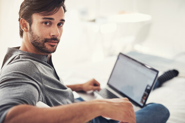 Sofa, relax and portrait of man with laptop screen for search, networking and online project in home. Smile, remote work and person on couch with computer for streaming, email or web subscription.