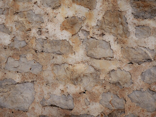 Fototapeta premium Stone wall as a background or texture. Part of a stone wall.