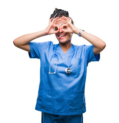 Young braided hair african american girl professional surgeon over isolated background doing ok gesture like binoculars sticking tongue out, eyes looking through fingers. Crazy expression.