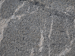 Dark aged shabby cliff face. Texture of mountains.
