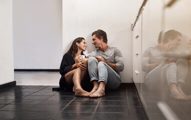 Relax, coffee and couple on kitchen floor with smile, morning bonding together and relationship...
