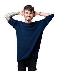 Fototapeta premium Young handsome man over isolated background Relaxing and stretching with arms and hands behind head and neck, smiling happy