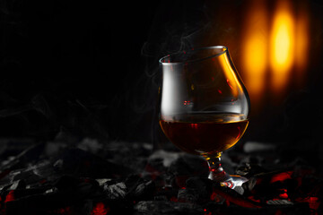 Snifter of brandy on a burning charcoal.