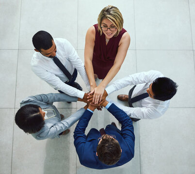 Business diversity, hands pile and teambuilding together from above in office. Corporate team, support and trust for hope, motivation and success working with commitment and union or collaboration