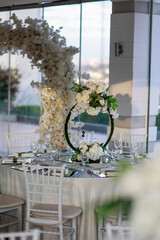 Elegant White Floral Centerpiece on Mirrored Table - Sophisticated Wedding Dinner Setting