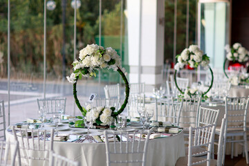 Elegant White Floral Centerpiece on Mirrored Table - Sophisticated Wedding Dinner Setting
