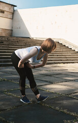 Outdoor fitness. Woman exercising in the park.