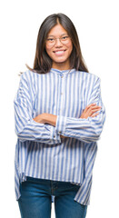 Fototapeta premium Young asian woman over isolated background happy face smiling with crossed arms looking at the camera. Positive person.