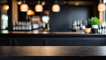 Empty the top of black wooden table with blurred counter bar background. For montage product display