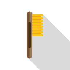 Cleaning brush with wooden handle and yellow bristles for shoe shine care is lying isolated on white background