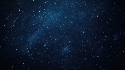 Obraz premium A dark, starry night sky background with twinkling stars, perfect for celestial and dreamy designs
