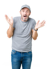 Handsome middle age hoary senior man wearing sport cap over isolated background clueless and...