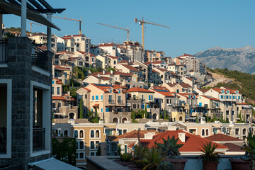 Luxury Mediterranean village on the coast of Adriatic Sea in Montenegro. Sunny day travel photos. Lustica bay town. 