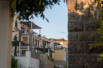 Luxury Mediterranean village on the coast of Adriatic Sea in Montenegro. Sunny day travel photos. Lustica bay town. 
