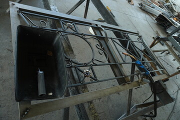 Forged gates created by a master. Made of durable metal carefully processed and welded with high skill. The gates are decorated with exquisite patterns of curls floral motifs and geometric elements.