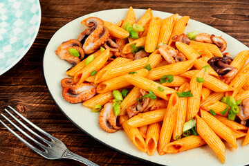 Macaroni with octopus pieces.