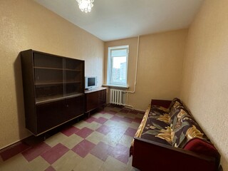 old soviet sofa and wooden cabinet
