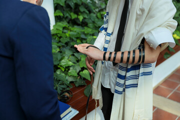 Traditional Jewish Tefillin Wrapping Ceremony - Spiritual Ritual and Cultural Heritage