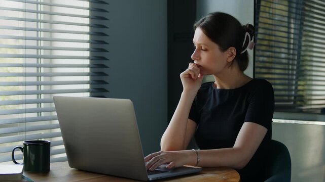 Pensive Young Woman Working With Laptop Thinking About Business Ideas Sitting At Desk At Home Office. Remote Job And Modern Technology Concept.