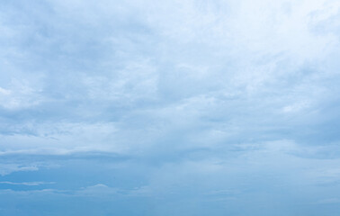 Bright blue sky with fluffy white clouds on a sunny day