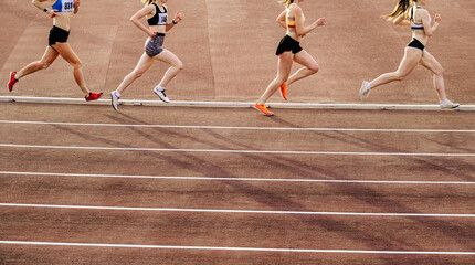 group women runner running 800 metres race in stadium