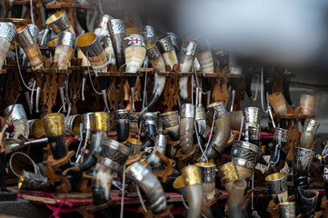 Collection of Ornate Drinking Horns on Display at a Local Artisan Market in Autumn