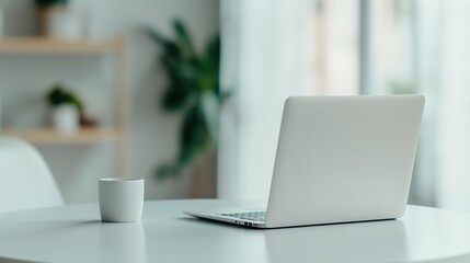 Fototapeta premium Modern workspace setup with a laptop, Ideal for illustrating productivity and minimalism in a professional setting 
