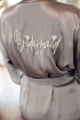 The back of a woman's satin robe with 