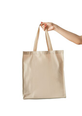 Hand holding canvas tote bag mockup isolated on white background