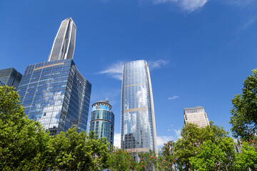 View of multi-story high-rise buildings made of glass and metal